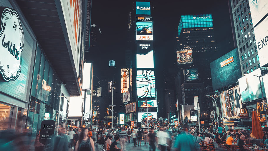 An image of a crowded Times Square at night