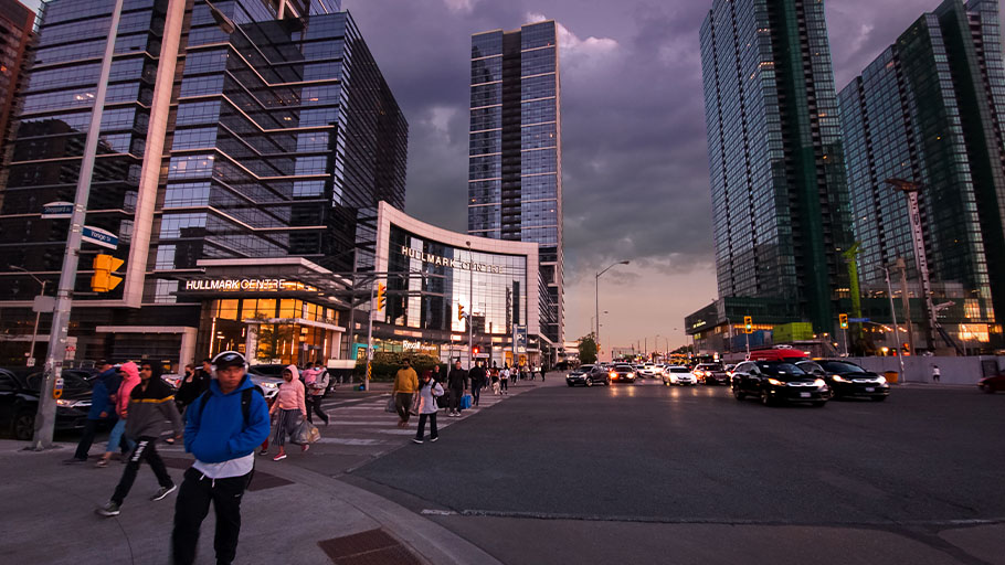 An image of a busy downtown Toronto street taken in the evening