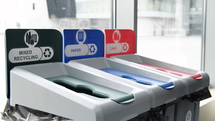 Segregated recycling bins inside a shopping mall.