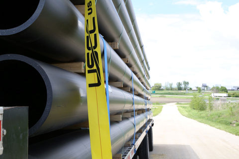 winch strap tie down on trailer holding heavy cargo